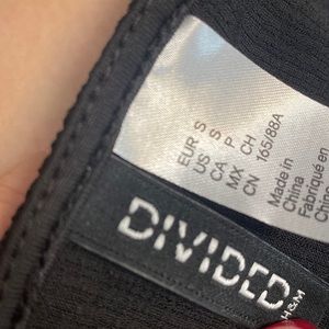 Women’s black v-neck crossover crop top with ruffle sleeves and ruffle bottom